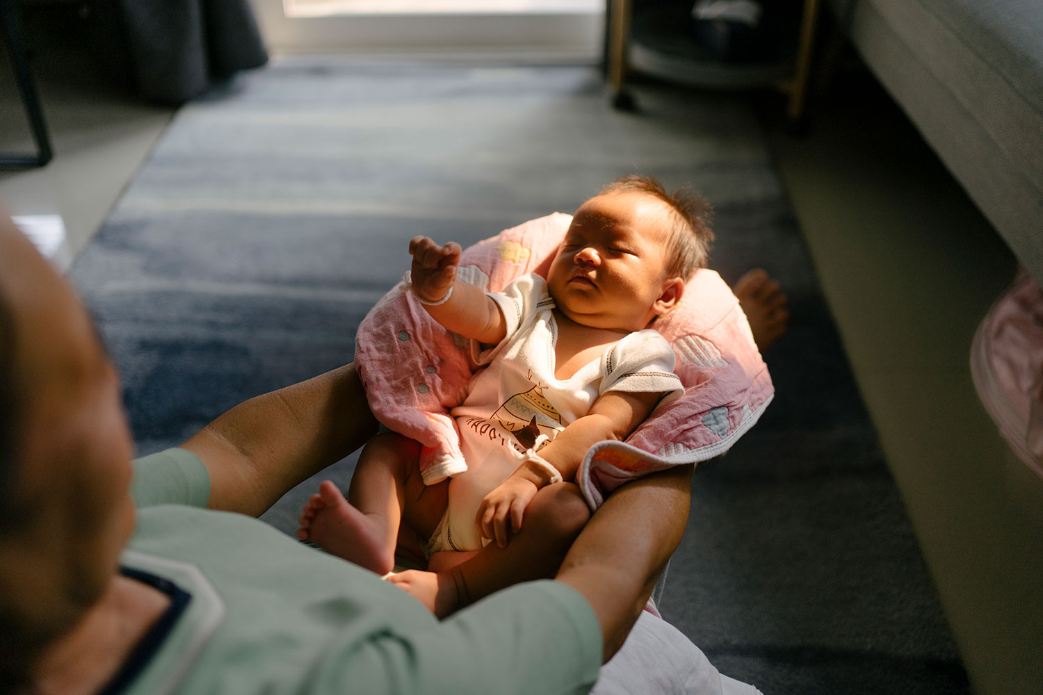 Man holding a baby in his arms