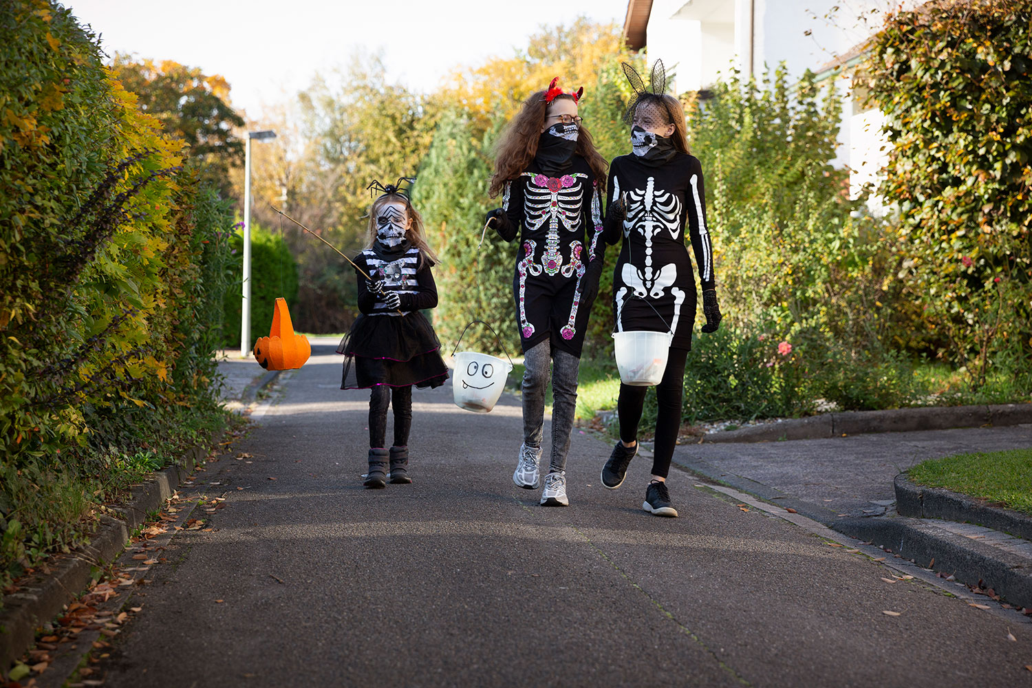 A group of children wearing Halloween costumes