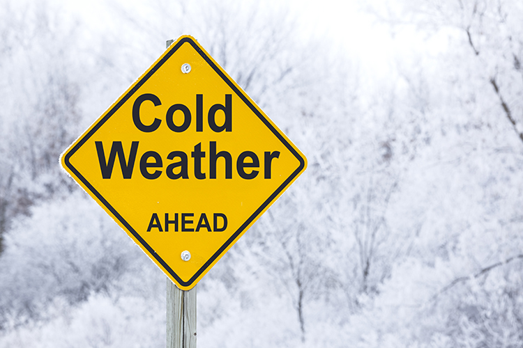 Graphic with a "Cold Weather Ahead" road sign