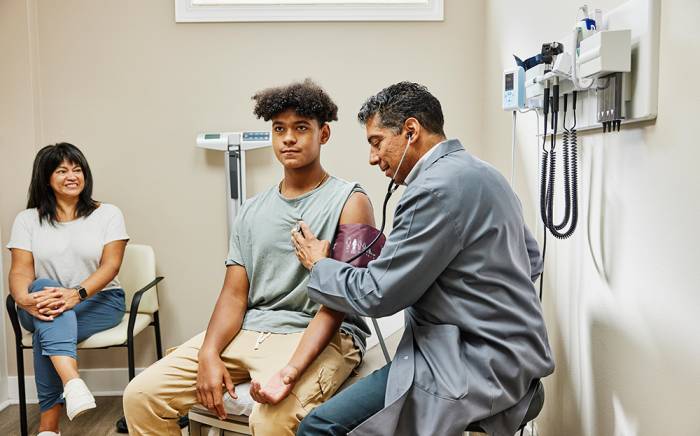 Young child being examined by a doctor in a doctor's office