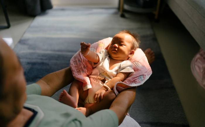 Man holding a baby in his arms