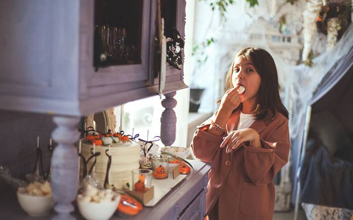 Child eating Halloween candy